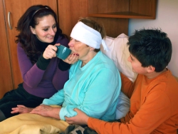 caregivers taking care of an elder